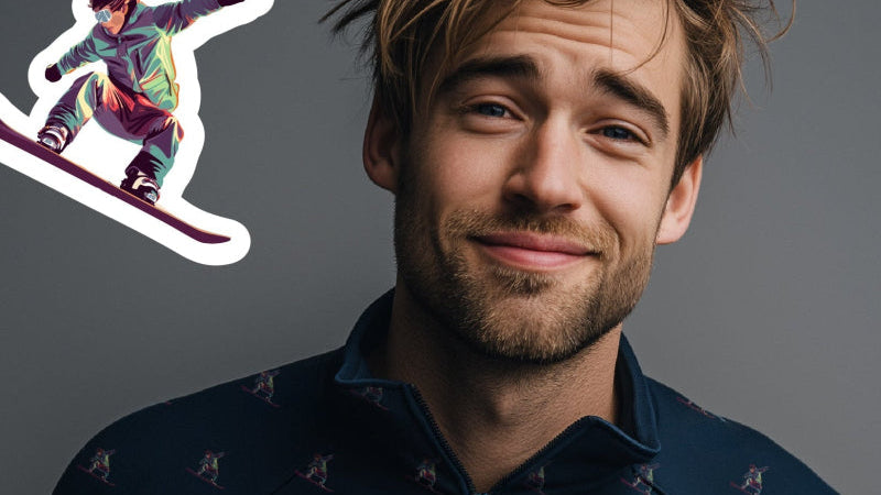 Man wearing a dark blue patterned shirt with text 'Layer Once Play All Day' and a snowboarding graphic.